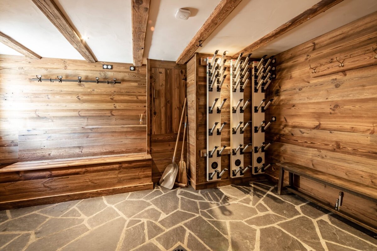 A room with wooden walls and a stone floor
