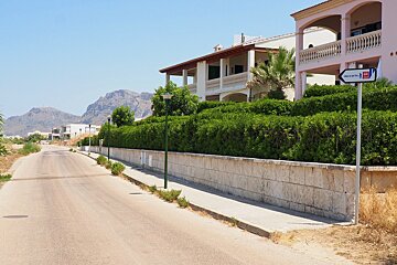 small villas by the side of a walking trail