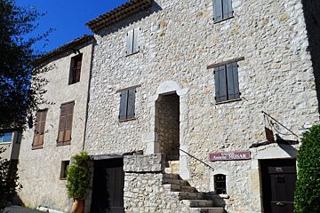 a stone house being used as an art gallery