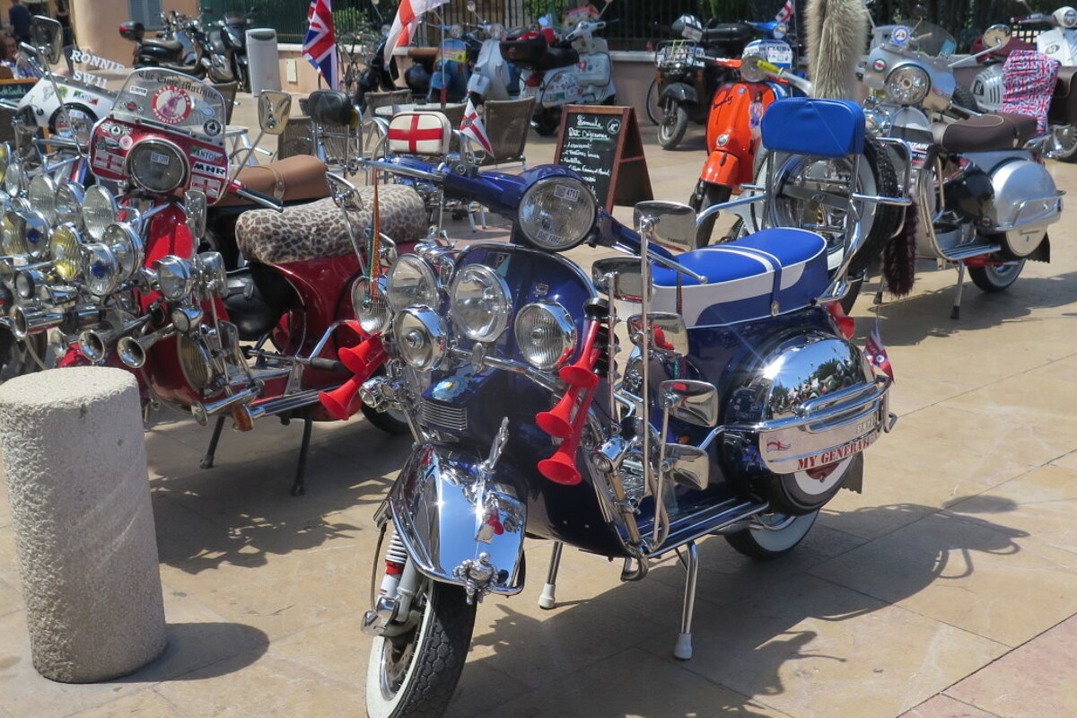 a line of vespas in st tropez