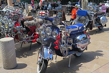 a line of vespas in st tropez