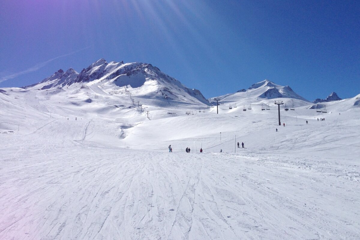 a sunny sky above the pistes of tignes