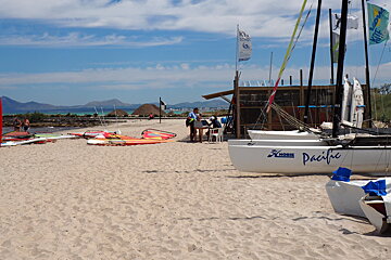 boats on the beach at a watersports centre