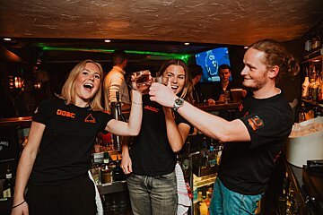 A group of people wearing shirts that say ogsc