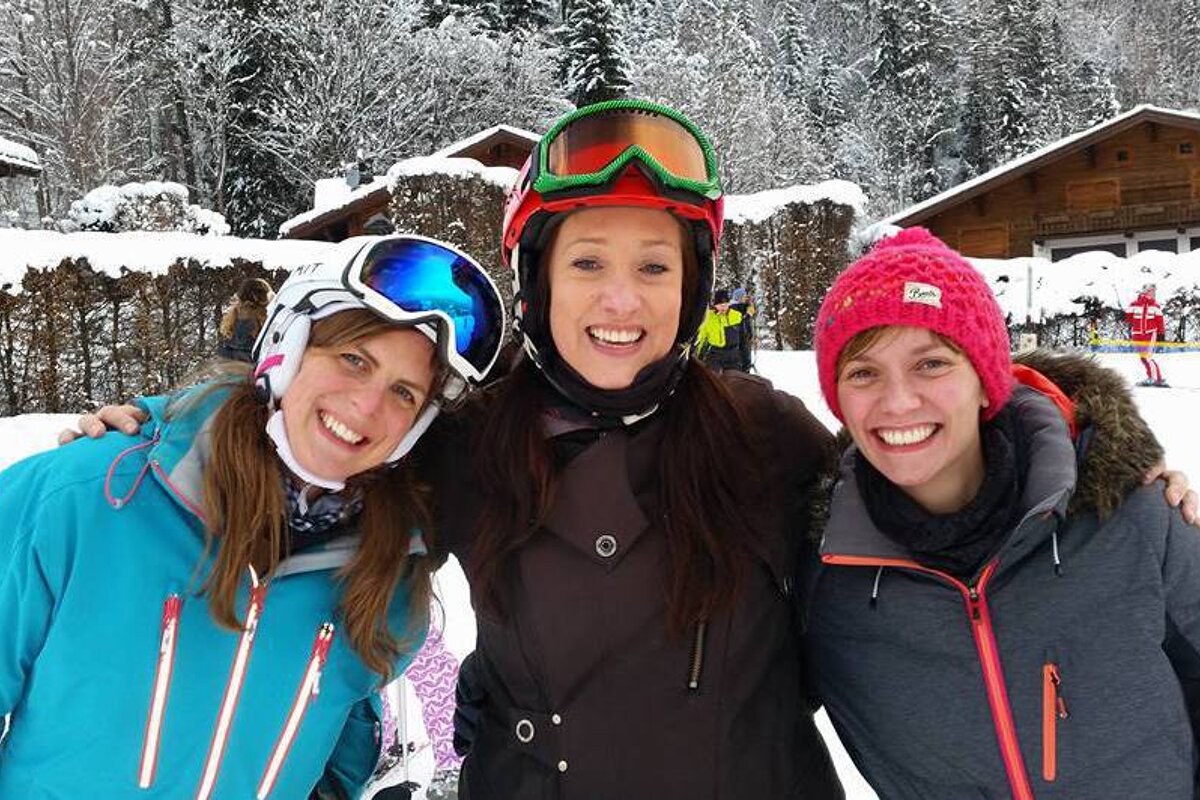 three beginner skiers