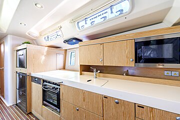 A kitchen with a stainless steel miele microwave