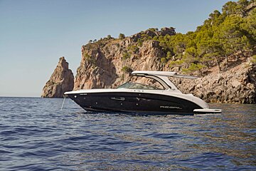 A black and white boat with the word regal on the side