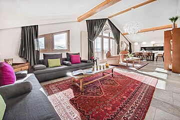 A living room with a couch and a coffee table