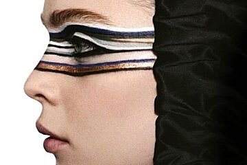 a fashion model with face paint