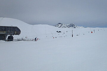 the top of a ski lift on a grey day