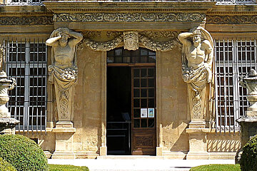 a grand doorway in an old stone house