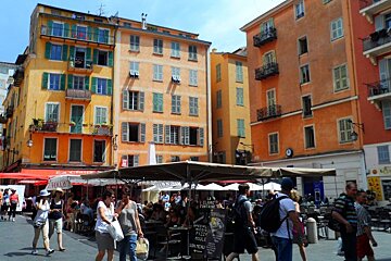 a few market stalls in a square in Nice