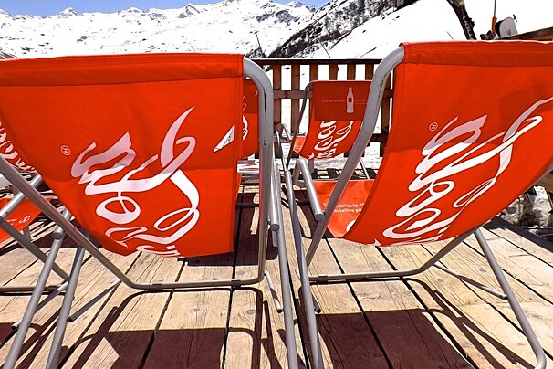 rows or red deckchairs in the sun-empty