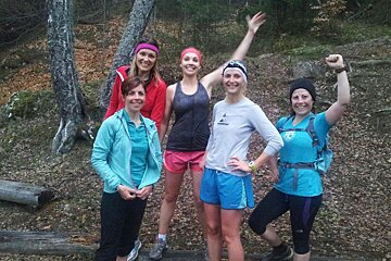 An image of a group of women runners in a forest near Chamonix Mont Blanc