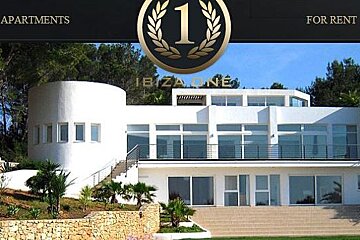 A large white house with a lot of windows is for rent in ibiza