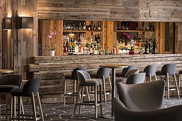 A bar with a lot of bottles on it