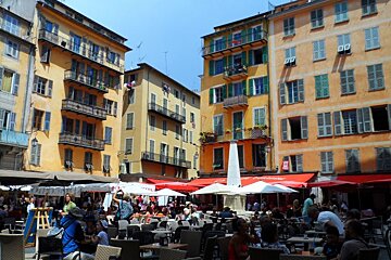 painted buildings in a square in Nice