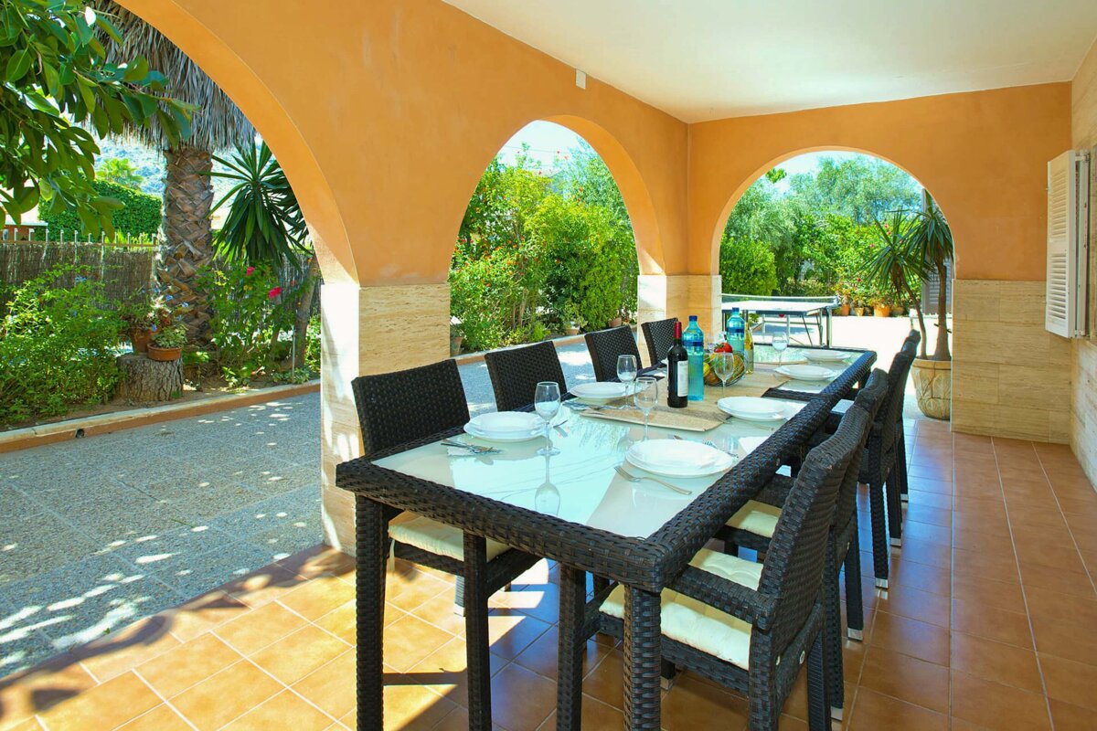 A table with plates and a bottle of wine on it