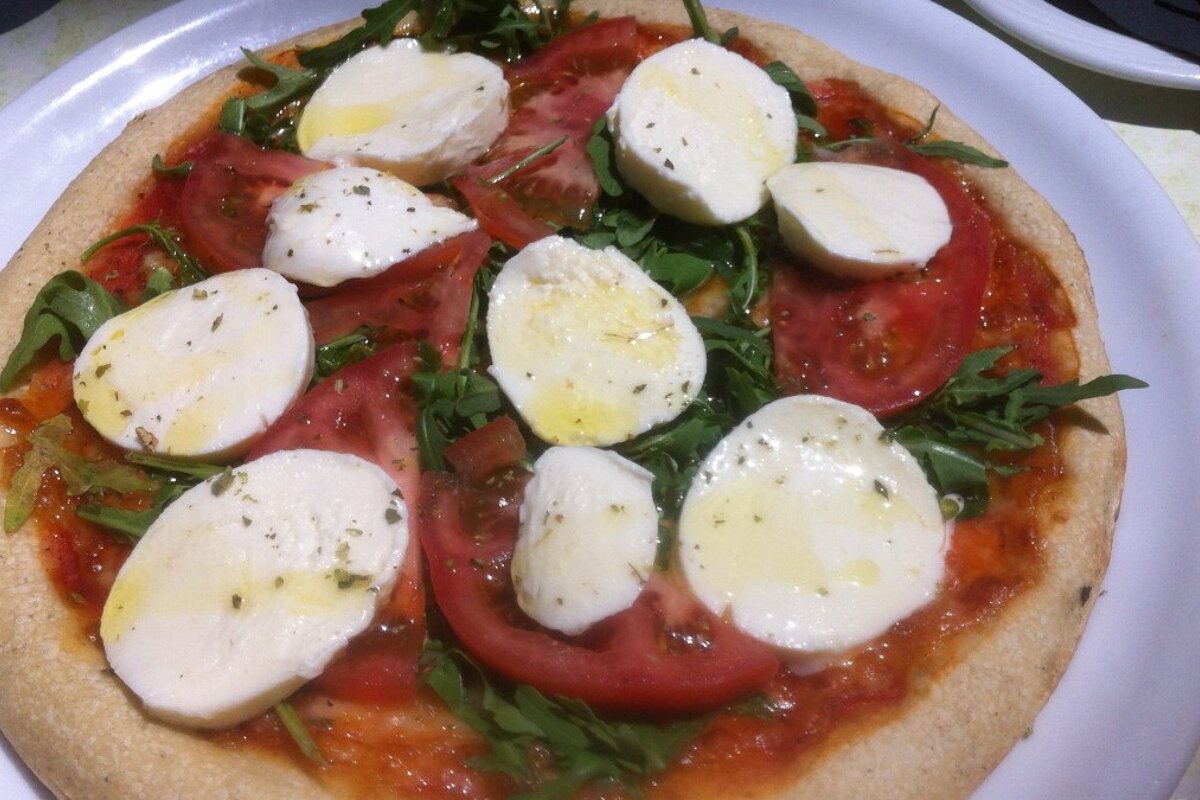 a large pizza with lots of mozzarella