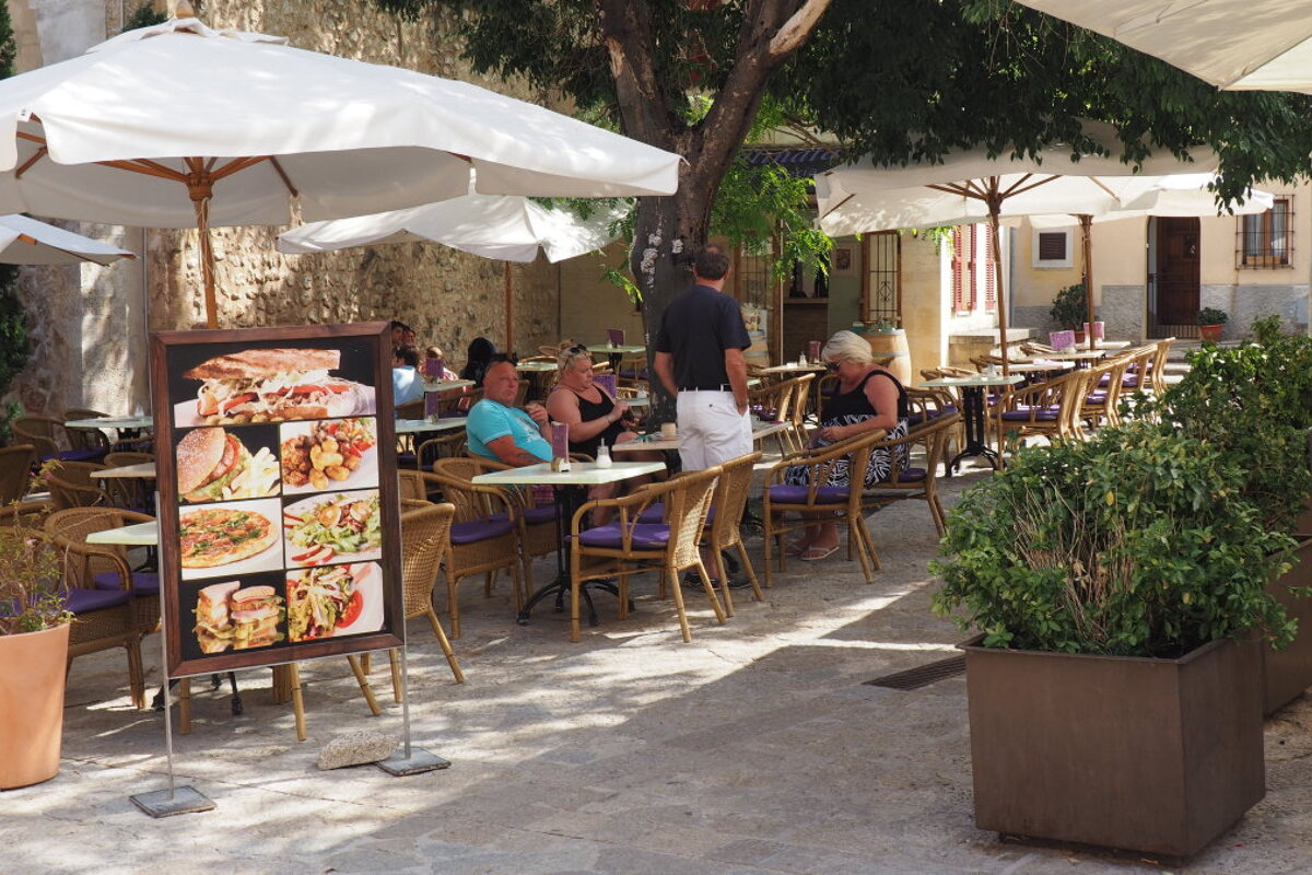 people choosing from the menu in a restaurant in mallorca