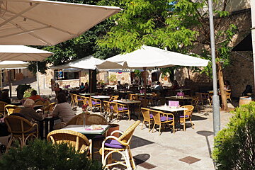 restaurant tables and parasols in north mallorca