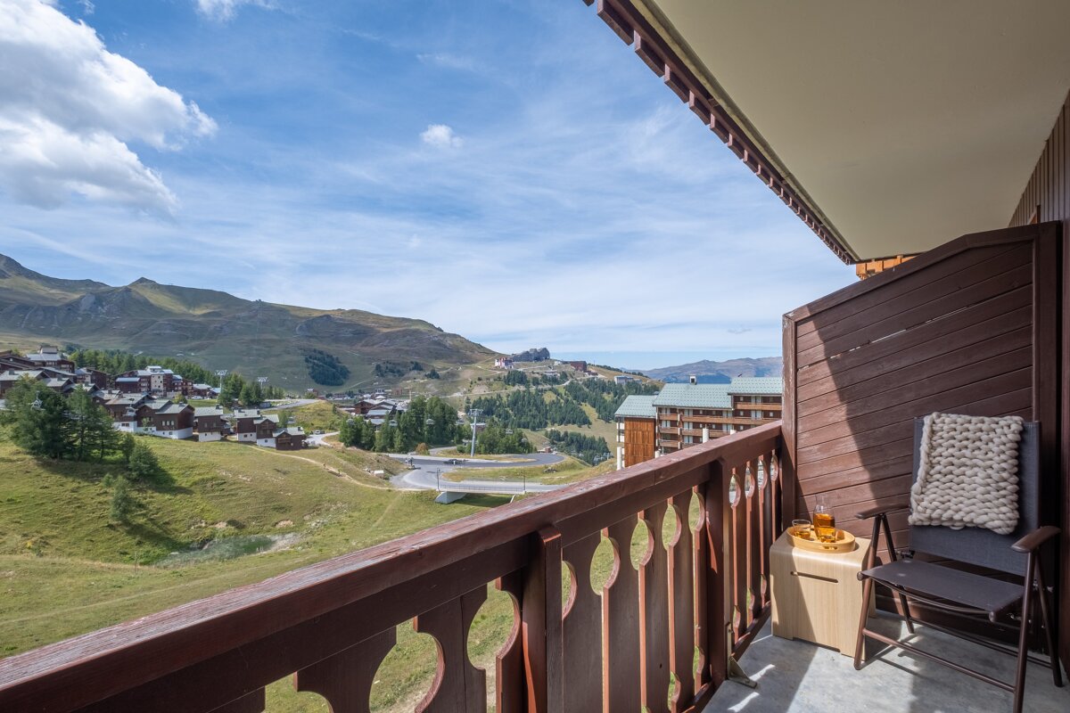 A balcony with a view of a mountain village