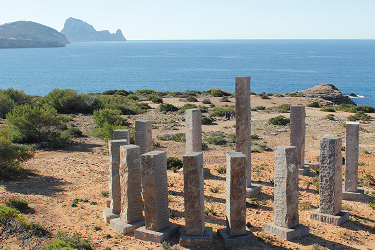 a view of the stonehenge rocks with es vedra in the background