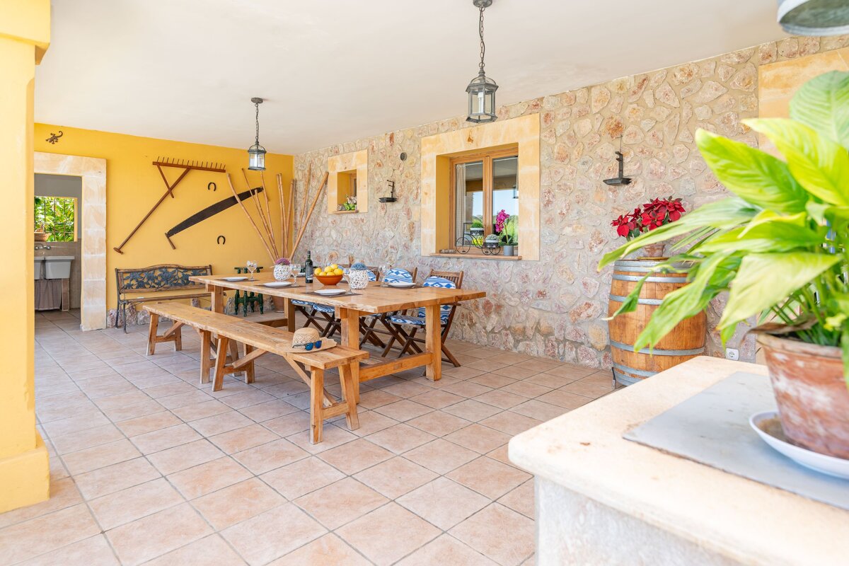 A dining area with a wooden table and benches