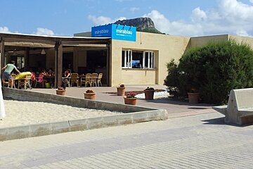 A restaurant with a blue sign that says mirablau