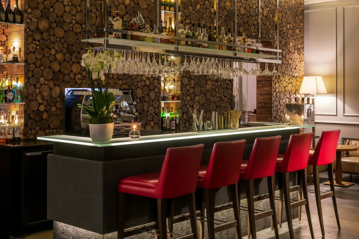 A bar with a lot of bottles on it