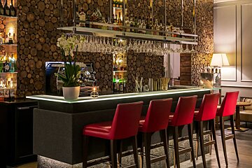 A bar with a lot of bottles on it