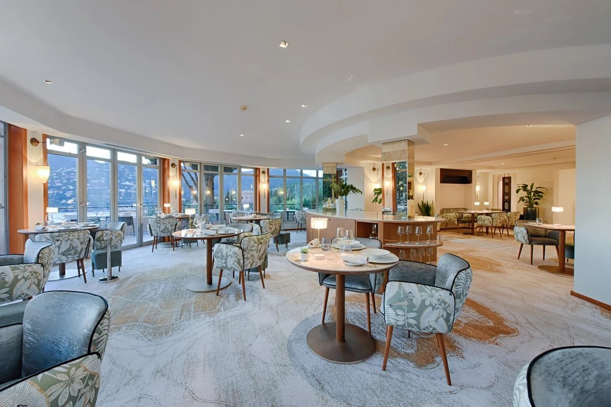 A restaurant with a lot of tables and chairs