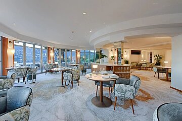 A restaurant with a lot of tables and chairs