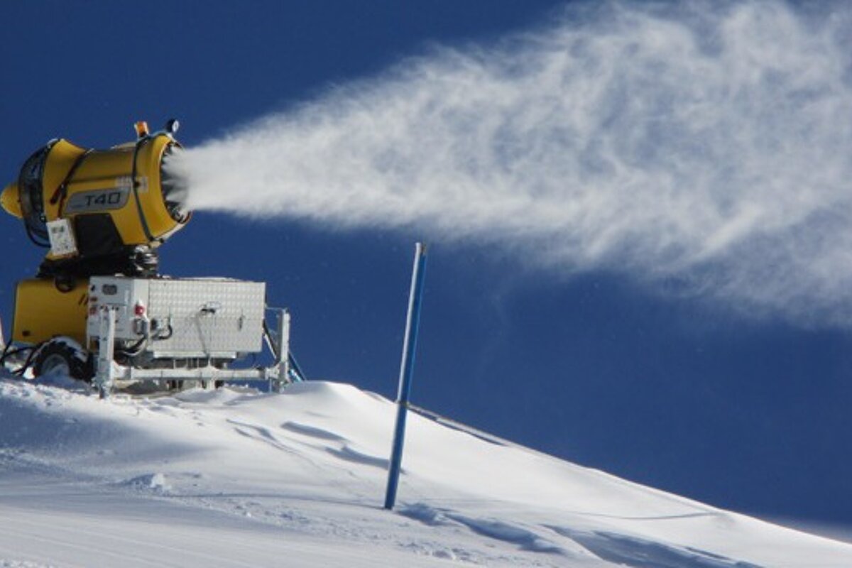 snow maker blowing out snow