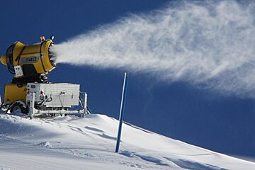 snow maker blowing out snow