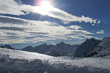 snow covered mountains and sunshine