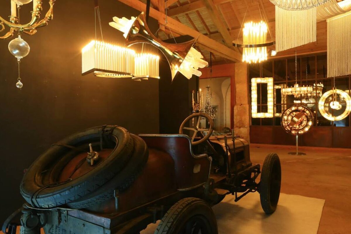 cars and chandeliers in a museum