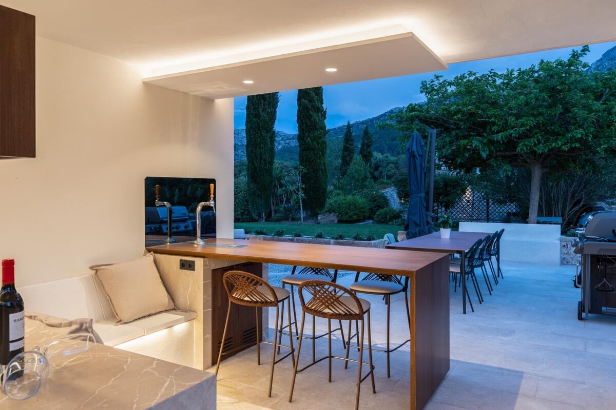 A bottle of wine sits on a counter in a kitchen