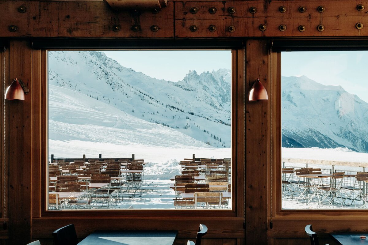 A view of a snowy mountain from a restaurant window