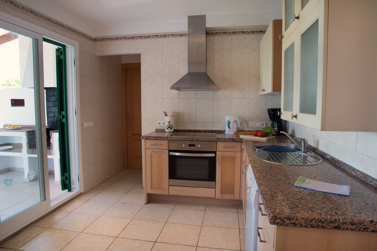 A kitchen with stainless steel appliances and granite counter tops
