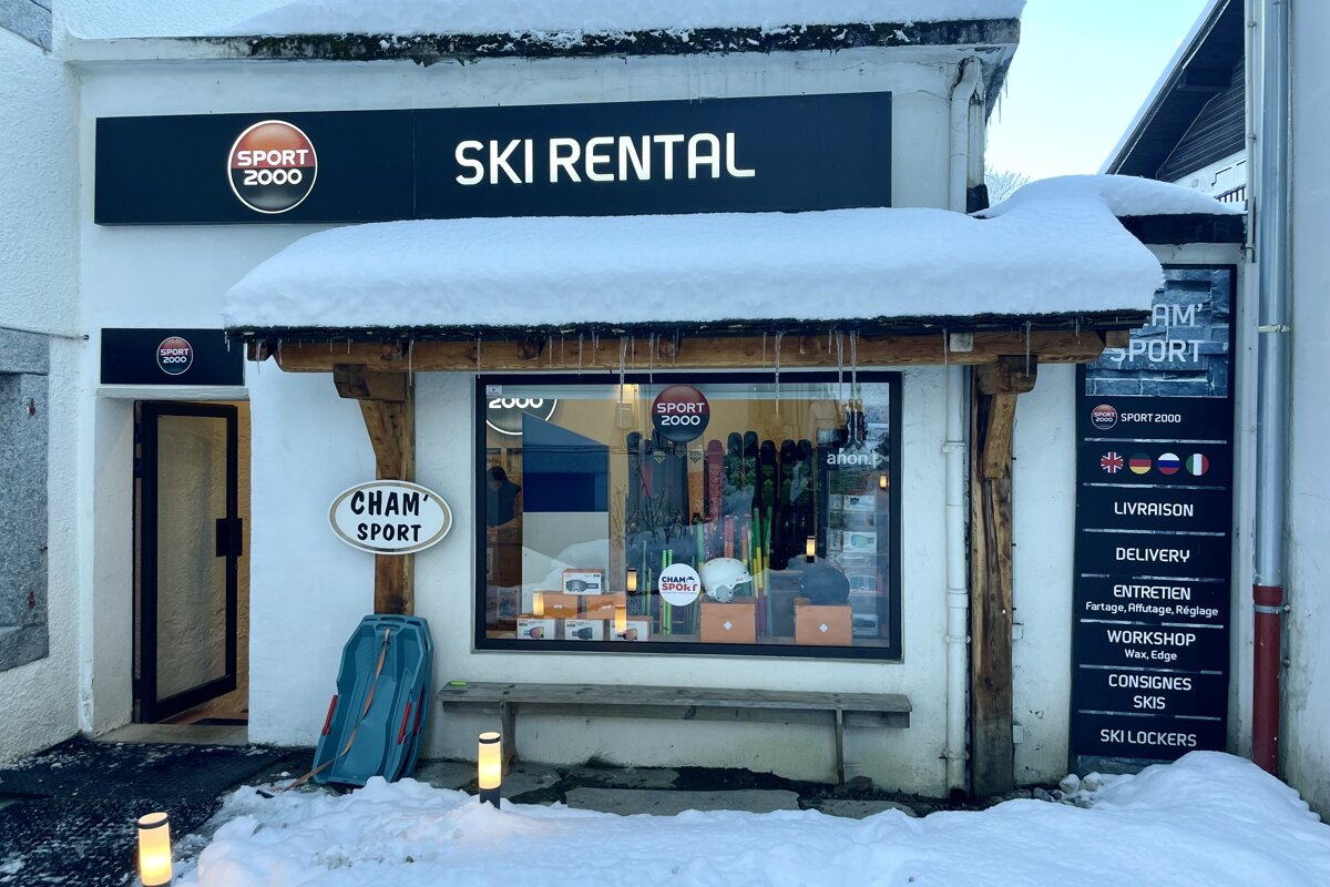 A ski rental store with a sign that says chan sport