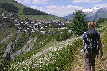 a man walking on a trail in 2 Alpes