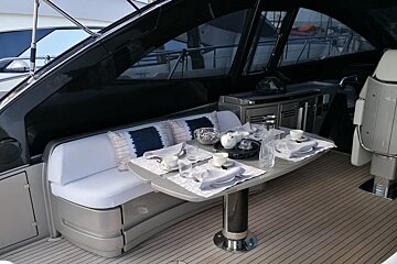 A boat with a table set for a meal