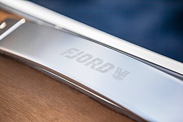 A close up of a ford logo on a piece of metal