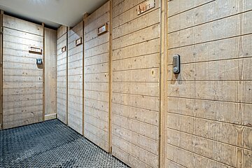 A row of wooden lockers with numbers on them