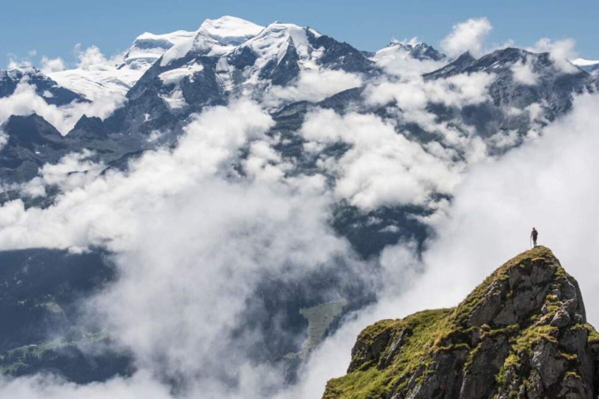 a pesron on topof a mountain in verbier