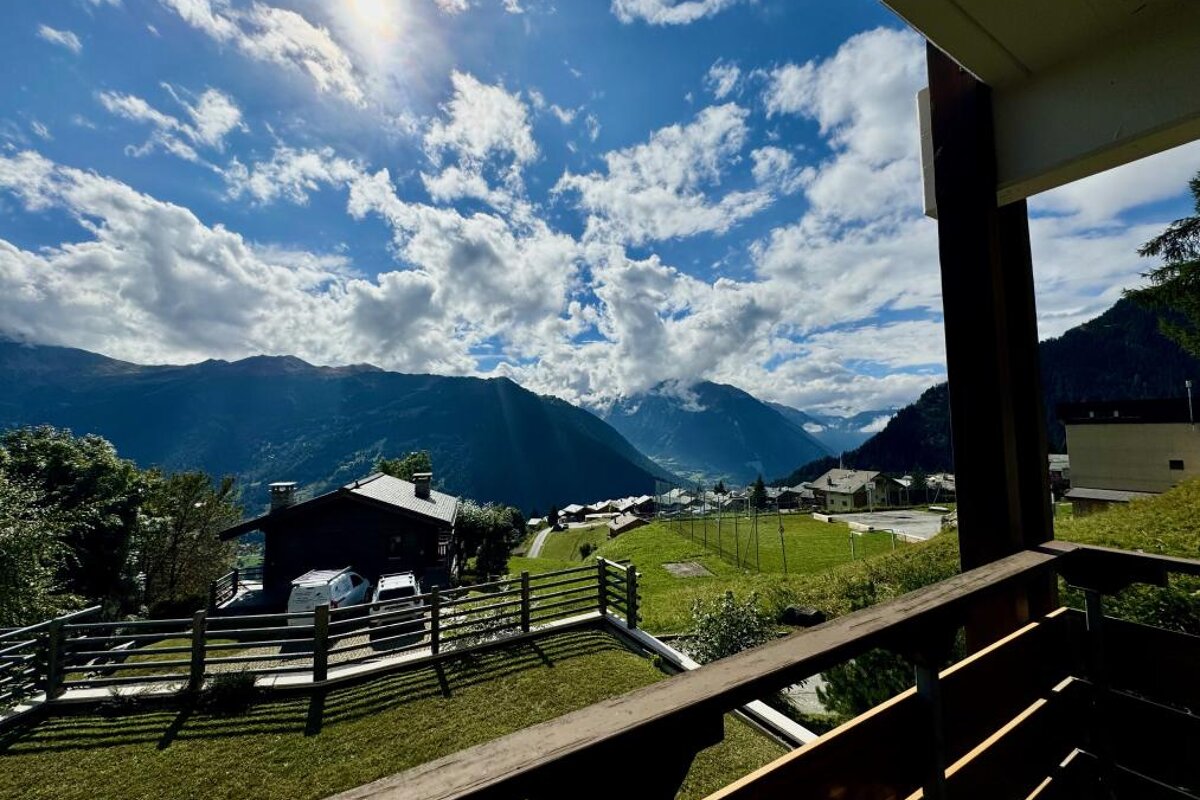 A view of a mountain range from a balcony