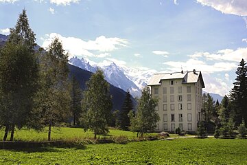 a tall white building in chamonix