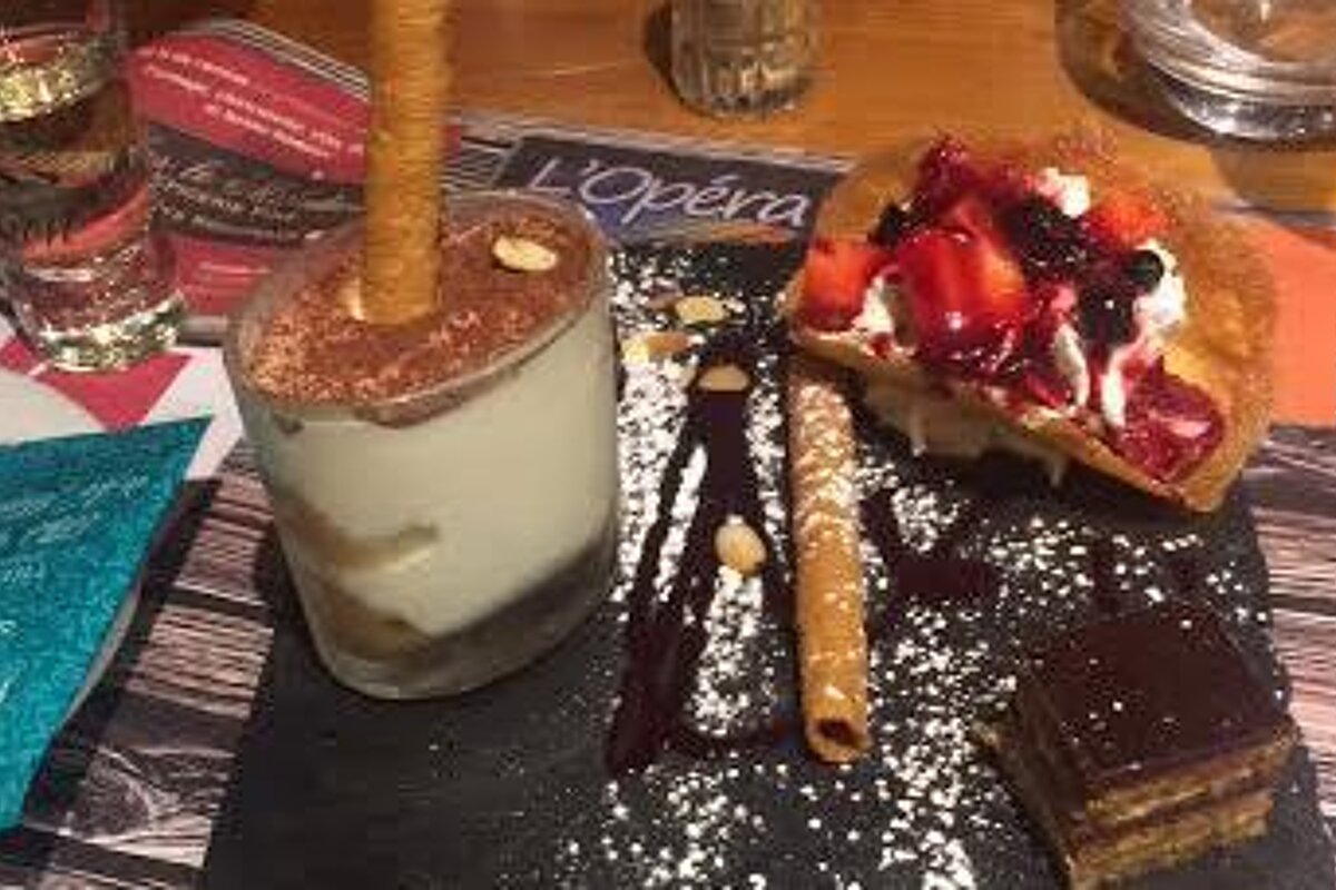 a selection of cakes with a coffee