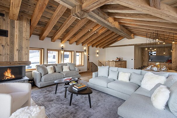 A living room with a couch and a fireplace